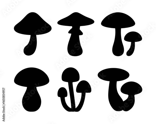Collection of six stylized mushroom silhouettes isolated on white background