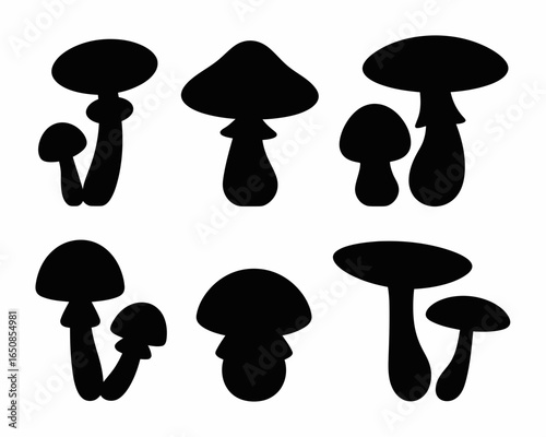Collection of various mushroom silhouettes in black isolated on white background