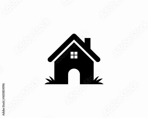 Simple black house silhouette with chimney and grass isolated on white background
