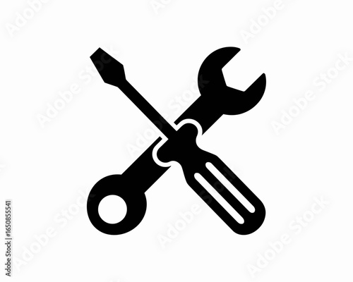 Crossed screwdriver and wrench silhouette isolated on white background