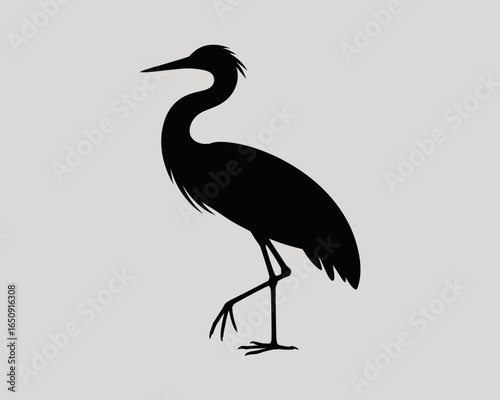 Elegant heron silhouette standing gracefully on one leg isolated on white background