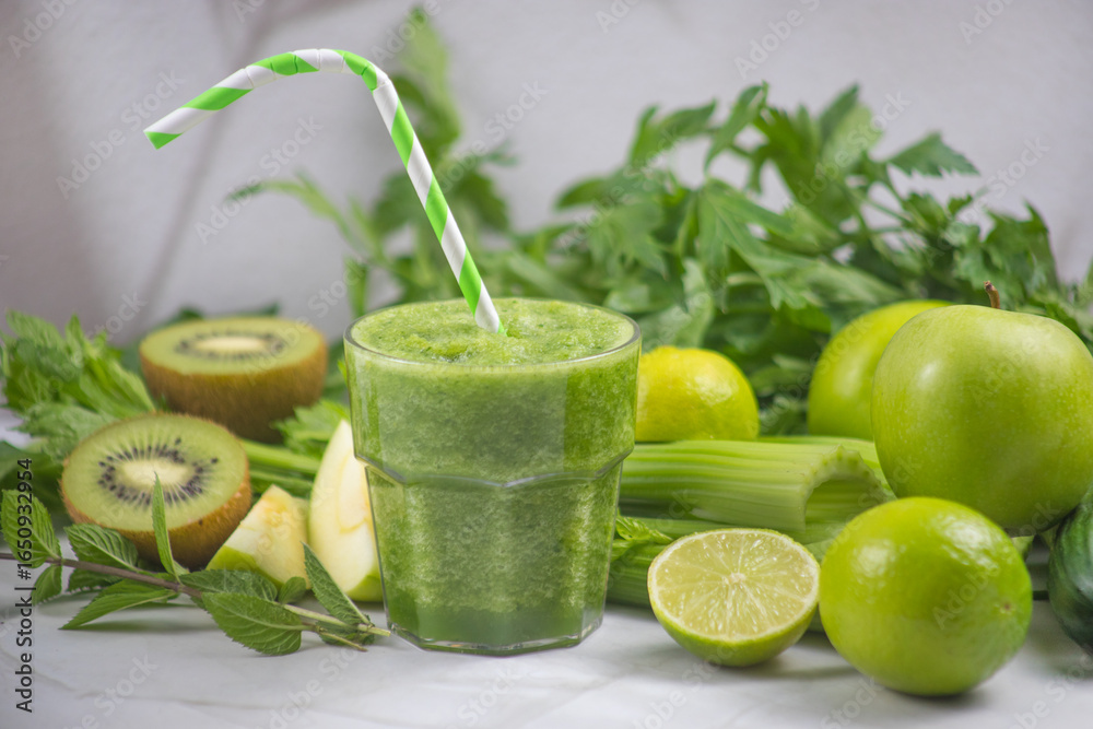 Fototapeta premium Refreshing green smoothie with fresh greens and citrus fruits