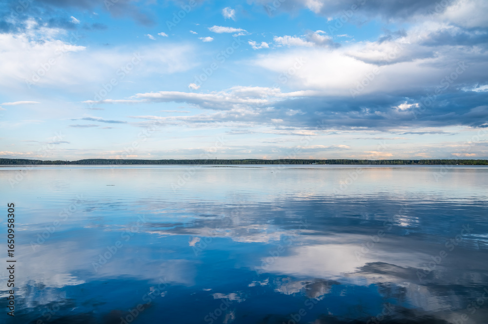Fototapeta premium Blue lake with cloudy sky, natural background