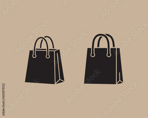 Two black shopping bags side by side on a neutral background