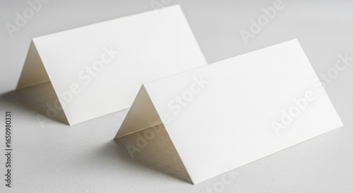 Blank White Tent Cards Set on Light Gray Surface for Table Placeholders or Menu Labels