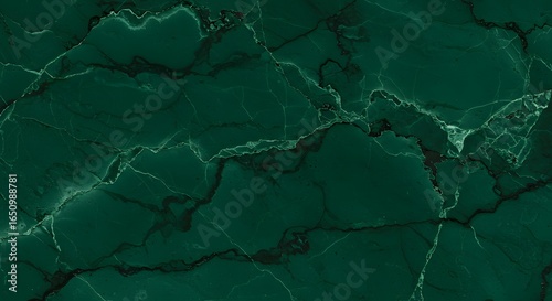 Emerald green marble texture with dark winding veins and subtle light cracks