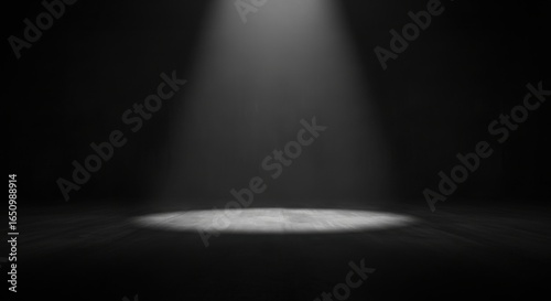 Spotlight Illuminating Empty Dark Stage with Focused Light in Theater or Performance Setting