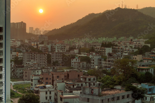 Photography zhuhai china cityscape under an orange sunset
