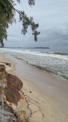 Ocean waves hitting sandy beach, relaxing natural video