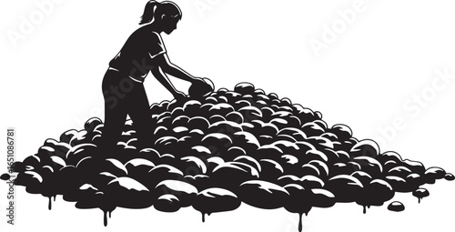 Silhouette of a woman sorting through a large pile of rounded st