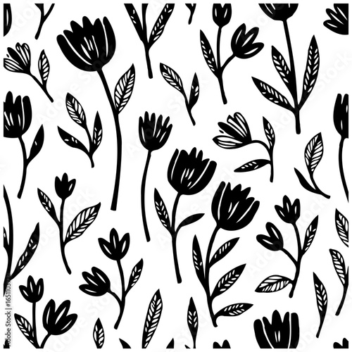 Floral pattern design showcases various elegant black flowers and leaves scattered across a white background