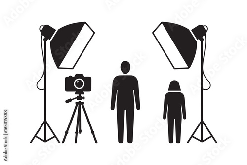 Studio lighting setup with camera and two figures photography