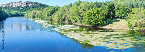 View from Meyronne along the Dordogne River to the cliffs at La Bastide in the region Perigord, France