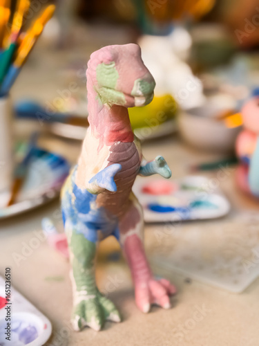 Colorful dinosaur art sculpture at creative painting workshop