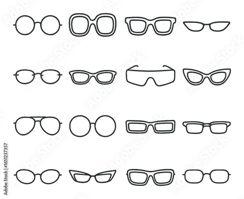 Variety of sunglasses and eyeglass frames on gray background