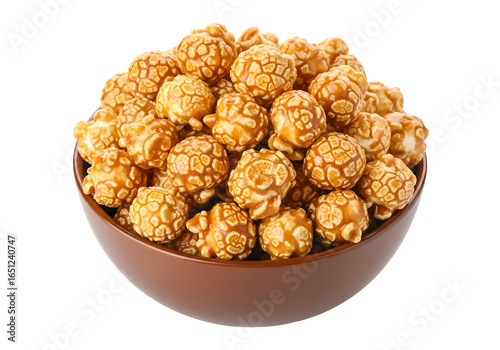 A full bowl of caramel popcorn is displayed against a black background.