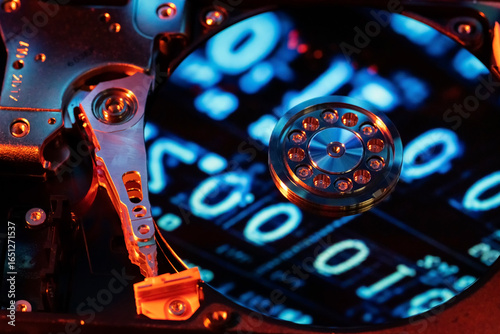 A hard disk with a blue binary code