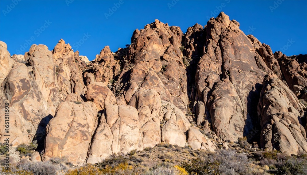 Fototapeta premium Rugged sandstone cliffs under a vibrant sky