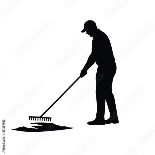 Gardener raking ground tool black