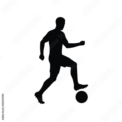 Silhouette of soccer player dribbling ball football