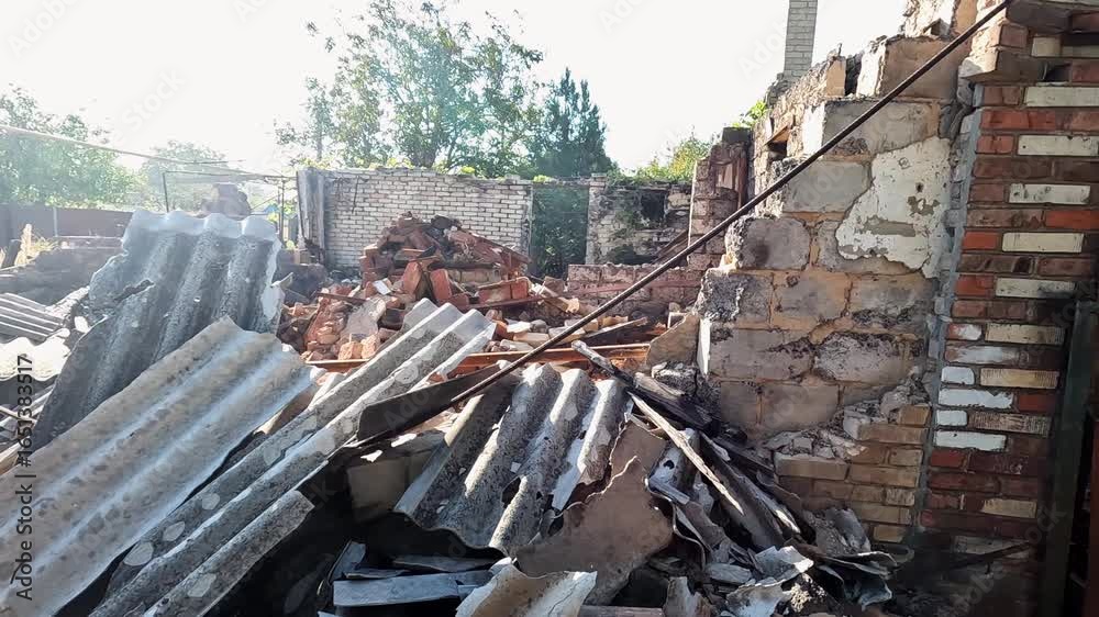 View to destroyed residential building at Donbass. Ruined house after bomb attacks on ukrainian territory from russia army. Consequences of russian invasion of Ukraine. Slow motion