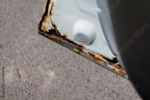 rust build on a car door