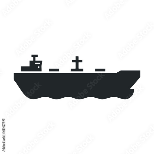 Silhouette of large cargo ship sailing on open sea at dusk