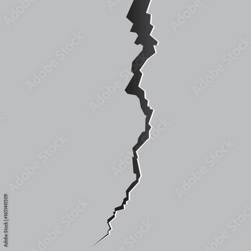A jagged black crack bisects a uniform gray surface, suggesting damage, separation, or the revelation of a hidden depth. The stark contrast draws immediate attention.