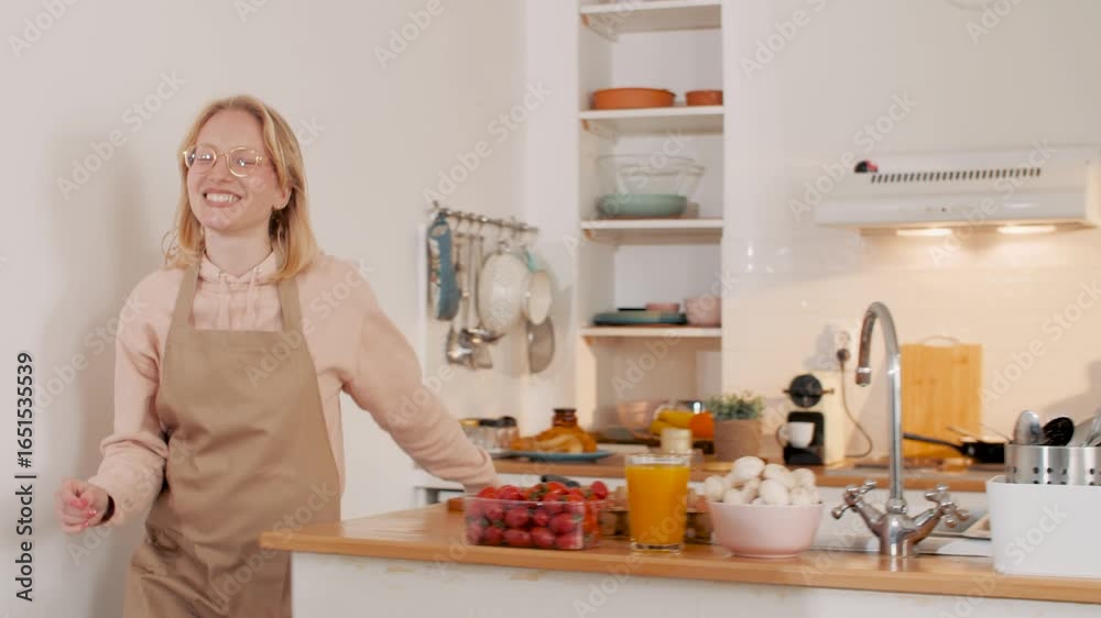 Couple cooking and working from home in kitchen Couple cooking and working from home in kitchen