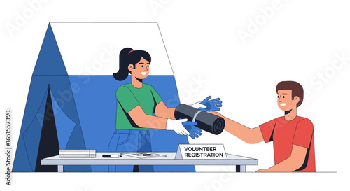 Volunteer registration booth: woman handing supplies to a smiling man.