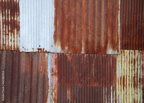 Фотография Artistic of old and rusty zinc sheet wall