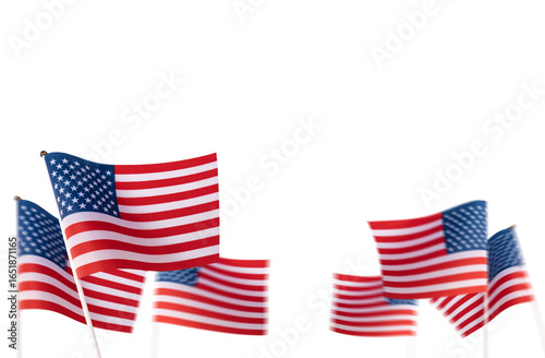 Several small USA American flags and pole stick for hand held waving isolated on transparent background or png file.