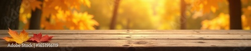 Empty wooden table, fall tablecloth, vibrant nature backdrop, template, red