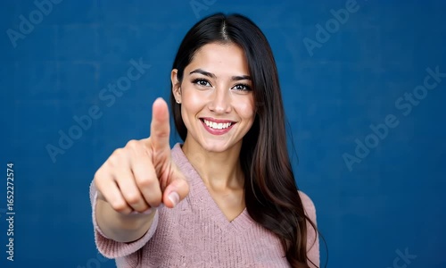 Picture of Happy and Smiling Woman Pointing Her Finger