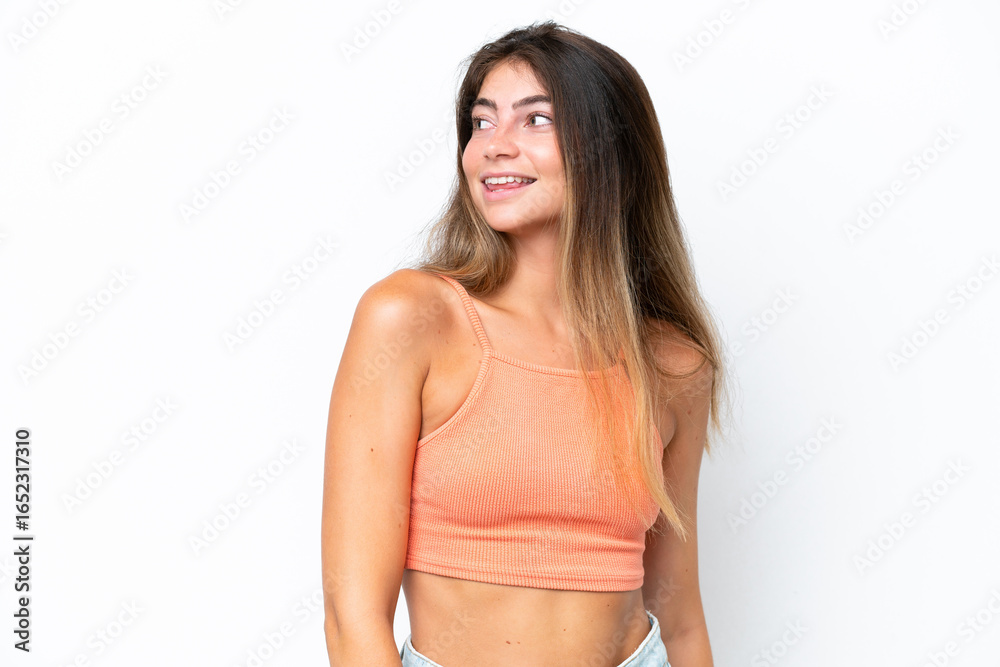 Fototapeta premium Young caucasian woman isolated on white background looking to the side and smiling