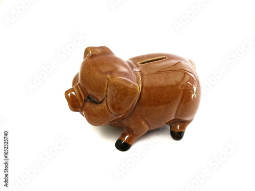 Close up brown piggy bank isolated in white background
