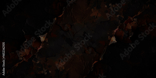 Textured landscape of cracked, earthy terrain with a mix of dark brown, reddish, and grayish tones, resembling a dry, rugged surface.	