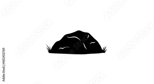 A dark stone is depicted with blades of grass on either side set against a stark white background