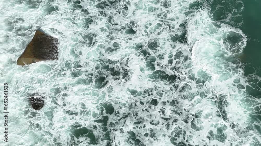 Giant ocean waves crashing and foaming on empty sand tropical beach ...