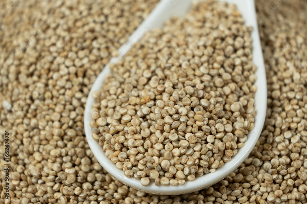 Natural white quinoa in a spoon macro Natural white quinoa in a spoon macro