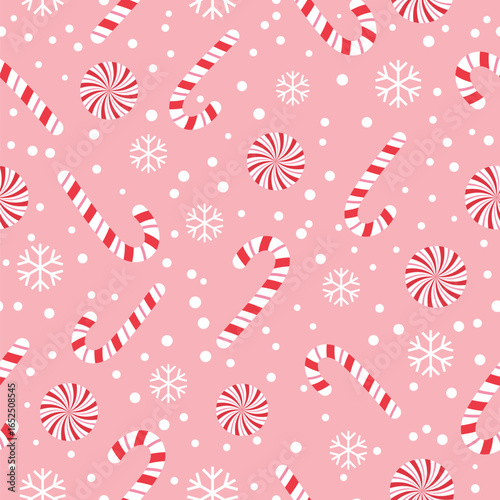 A cheerful seamless pattern with red and white striped candy canes, peppermint candies, and snowflakes on a soft pink background.