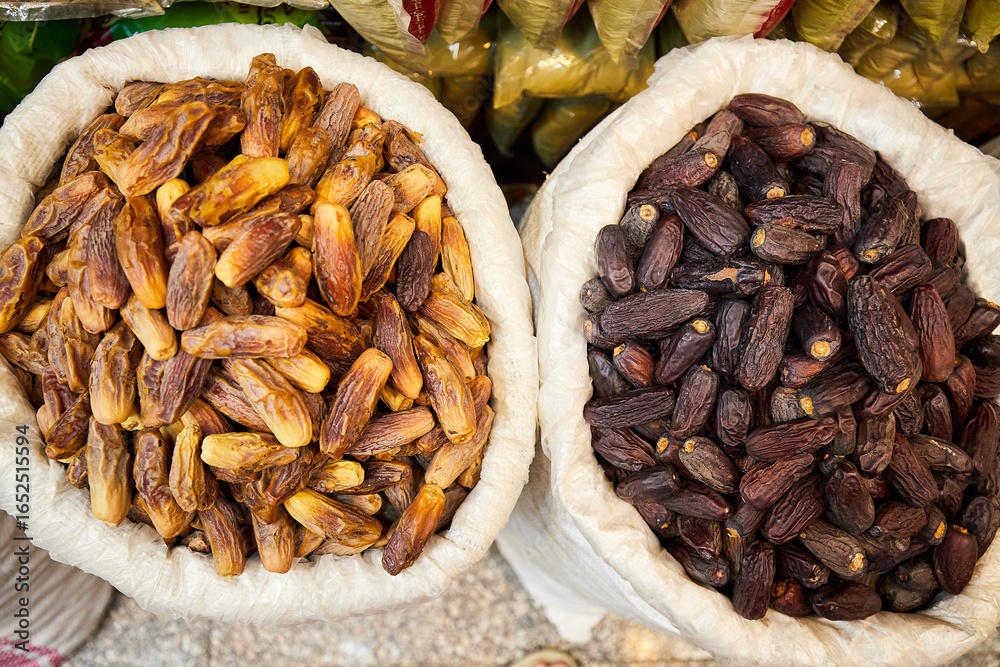 Obraz premium Two sorts of dates - dark and bright, sold at the market of Aswan, South of Egypt