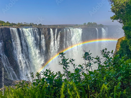 Canvas Print Victoria Falls in Zimbabwe with little water, rainbow.