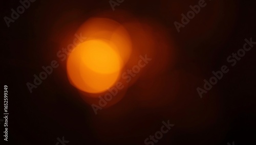 grainy colorful warm orange light leaks on black background with dust texture. abstract damaged scratched retro film analog effect for using over photos as overlay or screen filter