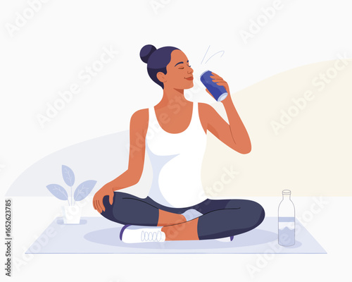 Woman in sportswear relaxing on yoga mat and drinking a refreshing canned beverage.