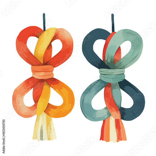 Two decorative knot ornaments with tassels one in warm tones and one in cool tones