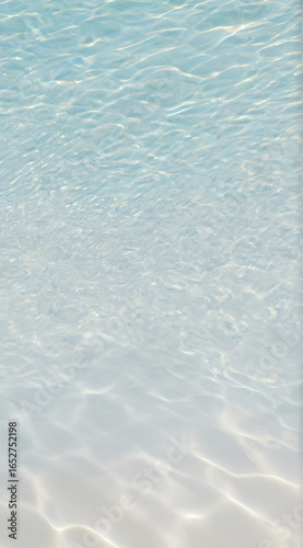 Clear shallow sea water with sunlight reflections on the surface