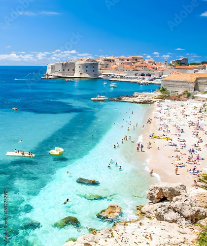 Fototapeta Naklejka Na Ścianę i Meble -  Crowded Beach by Historic City Walls