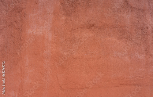 Stucco wall, terracotta plaster rough wall texture background