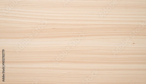 A smooth, light-colored wood surface featuring subtle grain patterns, ideal for design and construction projects.